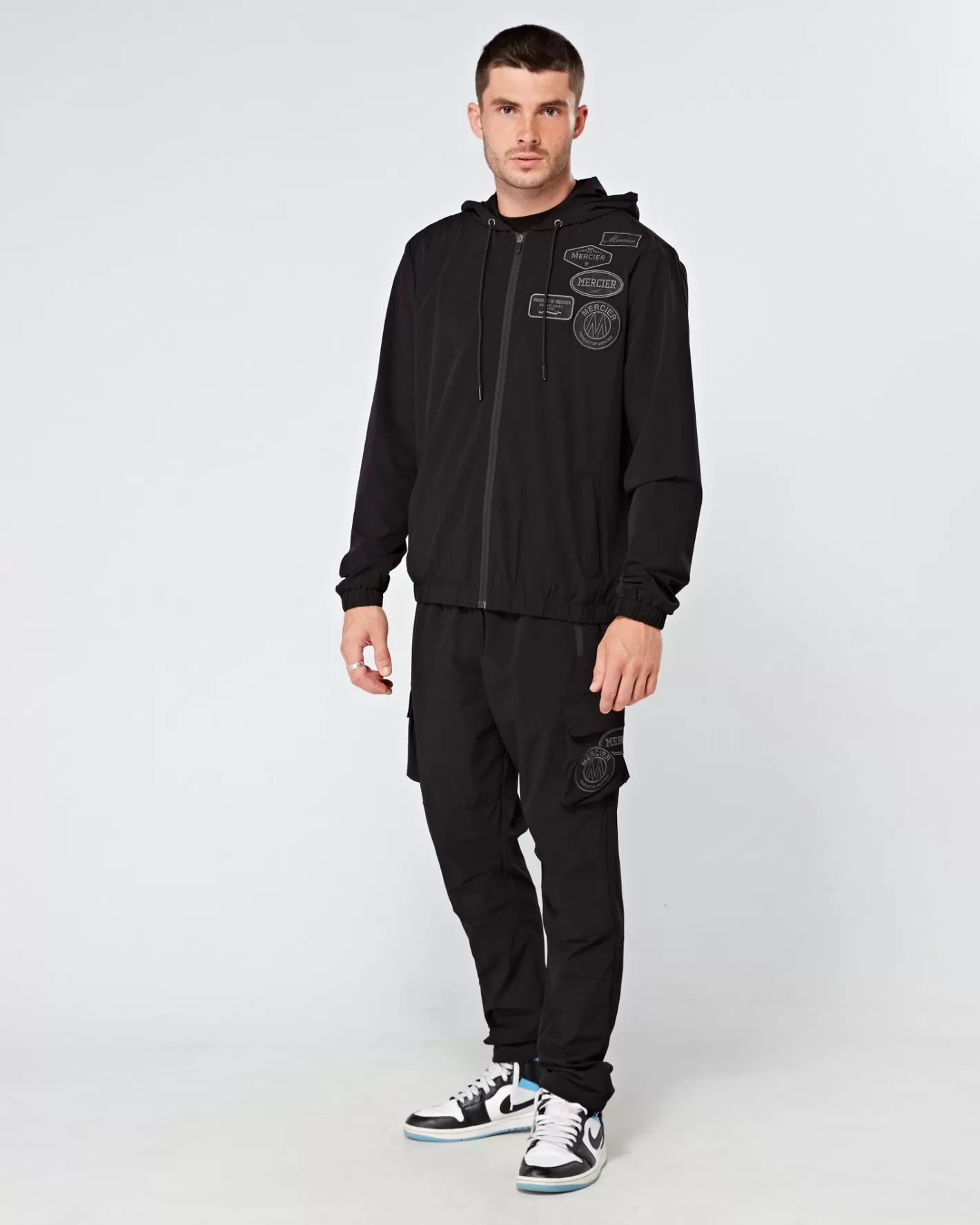 Homme Mercier Coupe-vent Et Cargaisons<Cargos de badge tonal noir